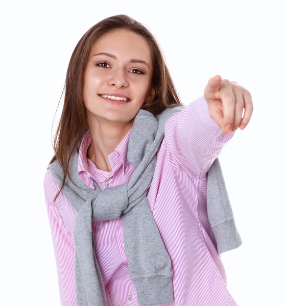 Junge Frau zeigt mit dem Finger auf weißen Hintergrund — Stockfoto