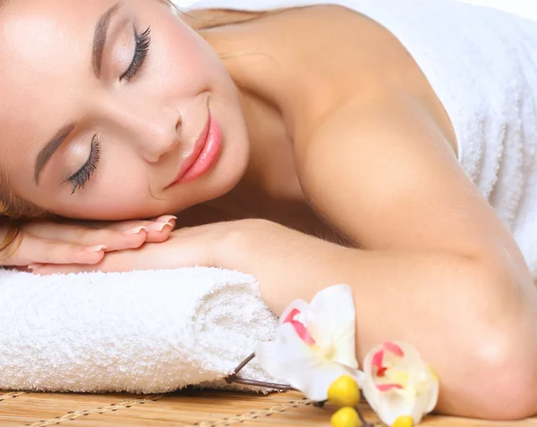 Closeup of an attractive young woman receiving massage — Stock Photo, Image