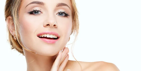 Studio shot of a beautiful young woman with perfect skin against a gray background. — Stock Photo, Image