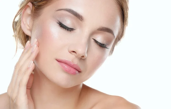 Studio shot of a beautiful young woman with perfect skin against a gray background. — Stock Photo, Image