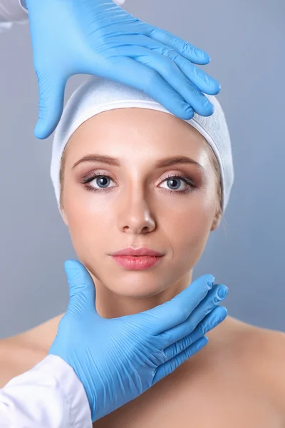 Cosmetic injection on the pretty woman face. Isolated on gray background — Stock Photo, Image