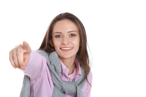 Молодая женщина указывает пальцем на вас на белом фоне — стоковое фото