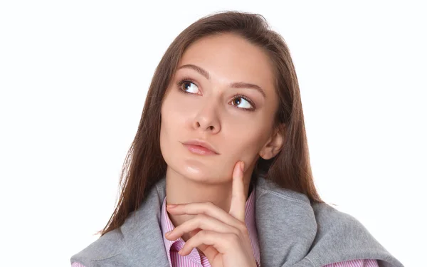 Mujer joven de pie sobre el fondo blanco — Foto de Stock