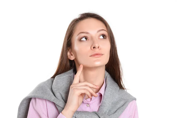 Mujer joven de pie sobre el fondo blanco — Foto de Stock