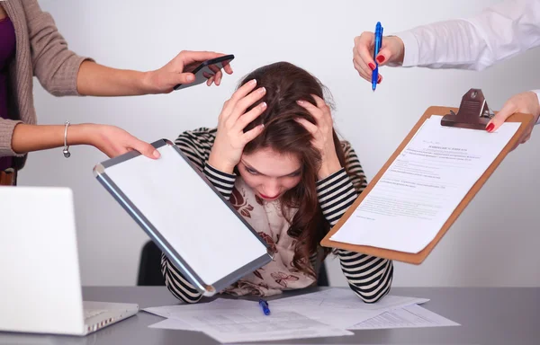 Portrait of tired young business woman with laptop computer — Stock Photo, Image