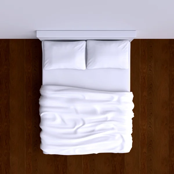 Cama com travesseiros e cobertor — Fotografia de Stock