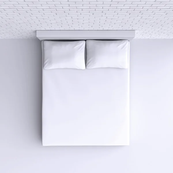 Кровать с подушками и одеялом — стоковое фото