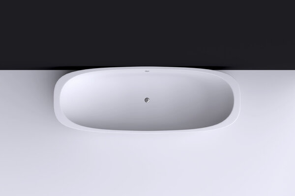 Modern white bath near wall