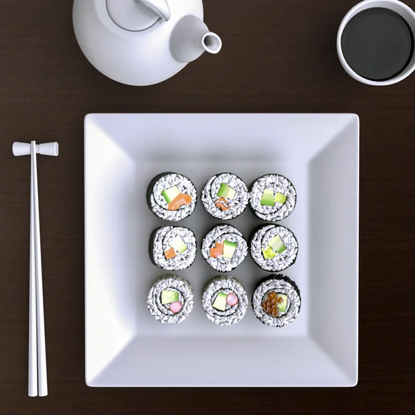 Tallrik med sushi och ätpinnar — Stockfoto