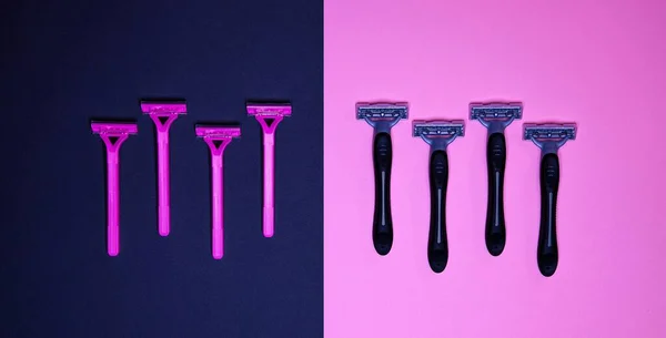 flat lay of Pink And Black Razors For Specific Genders. Social Theme Of Gender. Stereotypical Concept.