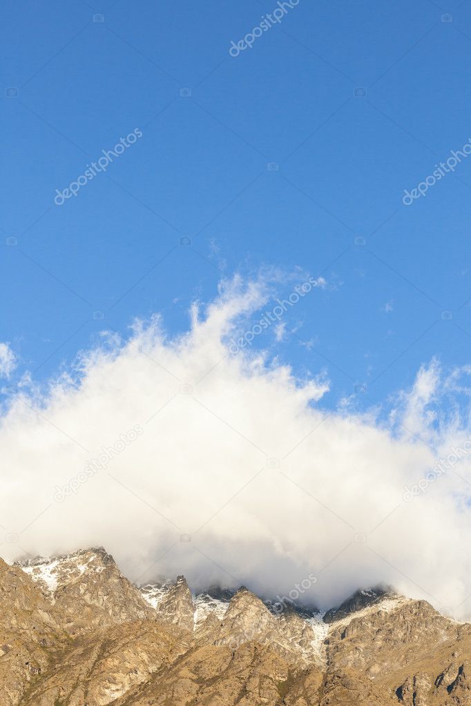 Mountain peaks covered in clouds