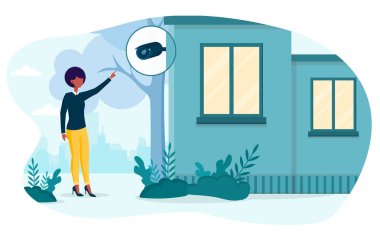 Siyah kadın güvenlik kameralarını kontrol ediyor.