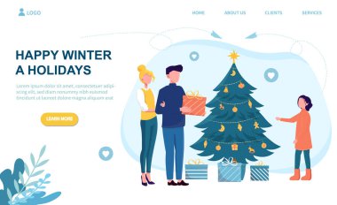 Kafkasyalı ebeveynler Noel ağacının yakınındaki kızlarına hediye veriyorlar.