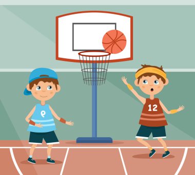 Basketbol oynayan iki küçük çocuk.