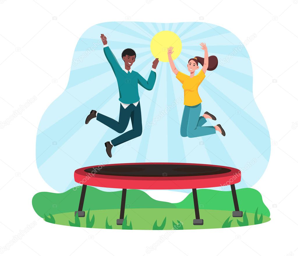 Multiracial couple are jumping on trampoline.
