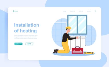 Neşeli erkek tesisatçı yeni ısıtma sistemi kuruyor.