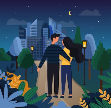 Geceleri parkta romantik bir randevuya çıkan sevimli bir çift.