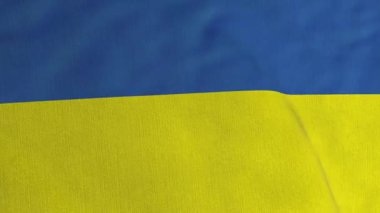 Ukrayna Bayrağı dokusu. Sarı ve mavi Ukrayna bayrağı rüzgarda dalgalanıyor. Kusursuz yakın çekim videosu. Spor ve vatanseverlik olayları. 3B canlandırma döngüsü canlandırılmış arkaplan