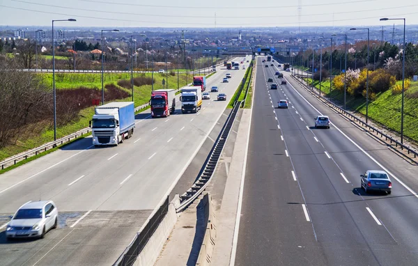 Highway transportation with cars and truck Royalty Free Stock Images