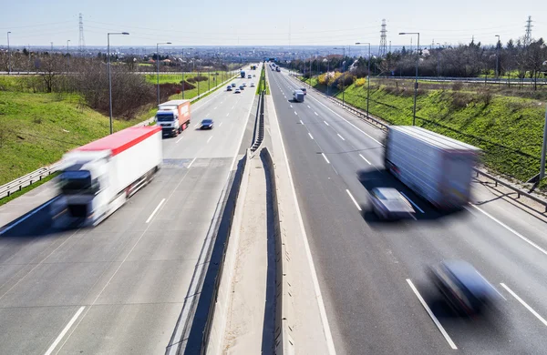 Highway transportation with cars and truck Royalty Free Stock Photos