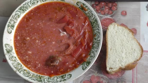 Man Eating Beetroot Soup Sour Cream — Stock Video