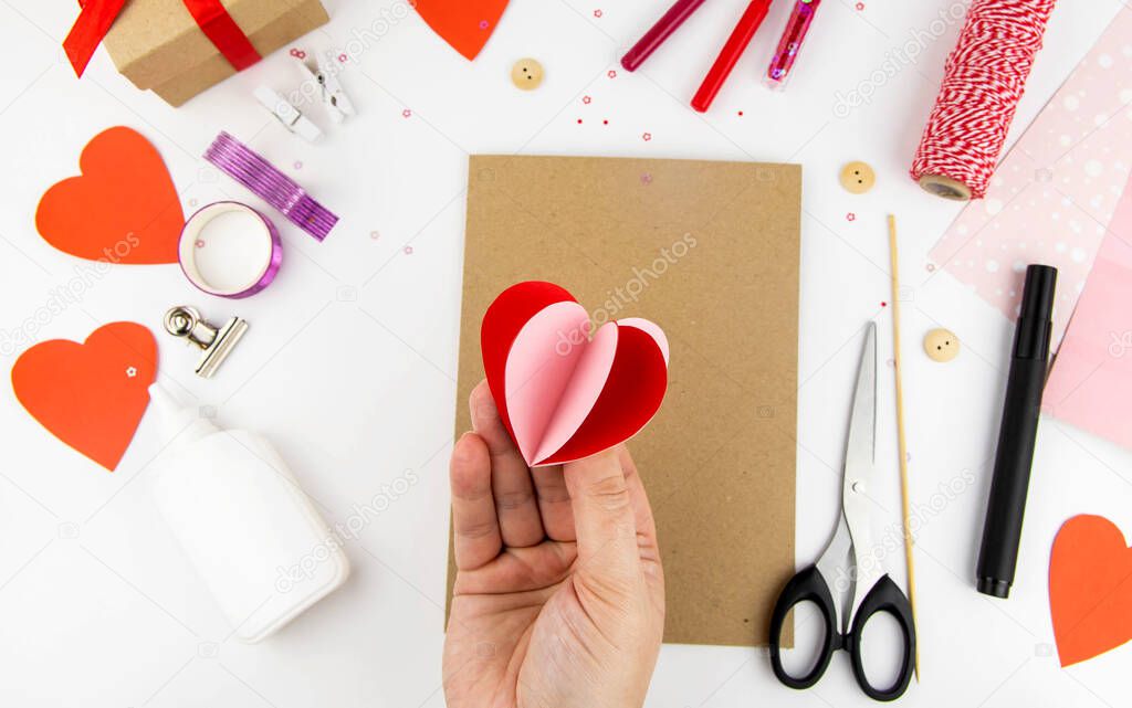 Valentine's Day. Instructions for making cards for Valentine's Day. Step 3 bend the hearts and glue them together in halves