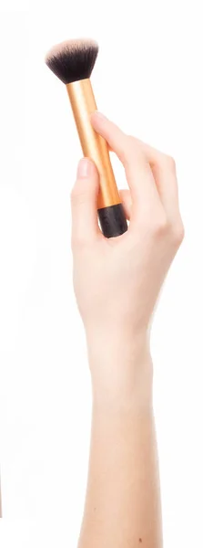 Woman Hand Holding Makeup Brush 图库照片