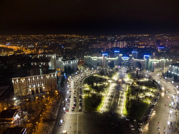 Aerial night view with holidays illumination lights of Derzhprom and Karazina National University on Freedom Svobody Square Kharkiv, Ukraine