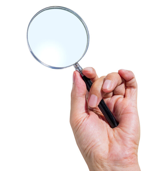 Man's hand holding magnifying glass 