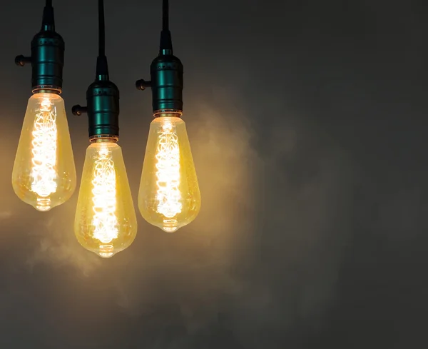 Vintage incandescent light bulb on service — Stock Photo, Image