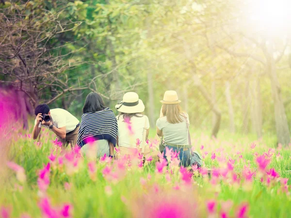 people enjoying flower field in outdoor activity