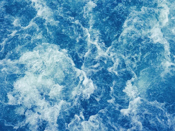 Cruise ship trails on water surface making white foam — Stock Photo, Image