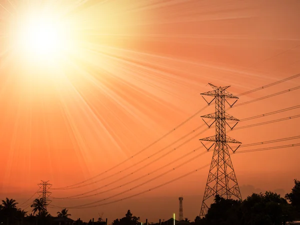 High voltage transmission line in tower on sunset — Stock Photo, Image