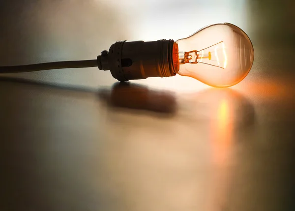 Vintage electrical incandescent lamp glowing — Stock Photo, Image