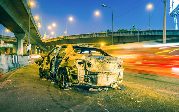 car damaged by fire in accident clash