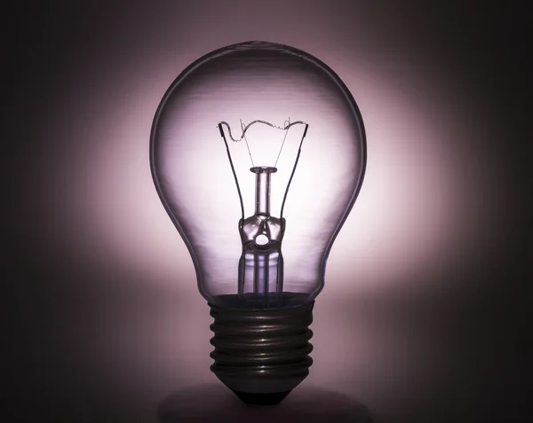 Light bulb on Silhouette shape — Stock Photo, Image