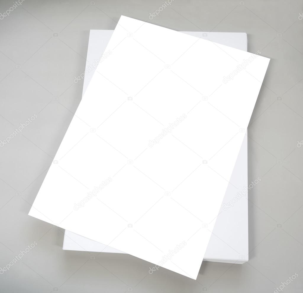 White plain office paper on gray background