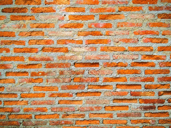 Cemento incrinato mostrando muro di mattoni invecchiato — Foto Stock