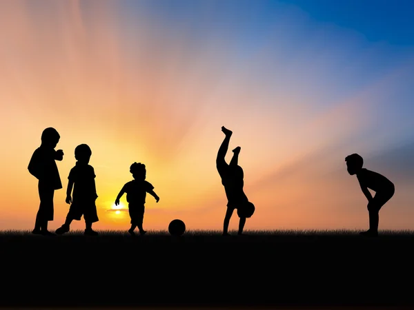 Silhouette of five little boys playing in sunset sky — Stock Photo, Image