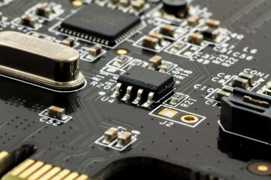 Printed Circuit Board (PCB) with, ICs, Capacitors, and Resistors clipart