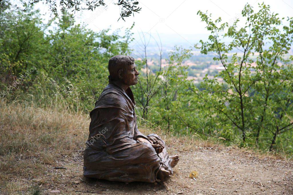 The statue of St. Francis near the church of San Damiano