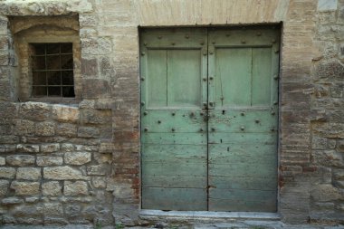 Ancient door in the city of Gubbio, Italy