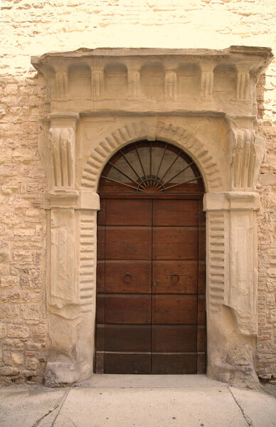 Ancient door in the city of Gubbio, Italy