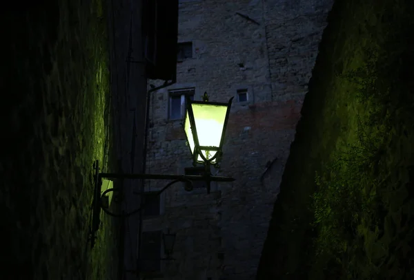 Street lamp in the night of Cortona, Italy