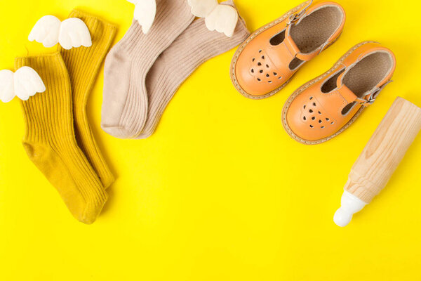 the first children's shoes, socks and an eco toy, in anticipation of the baby