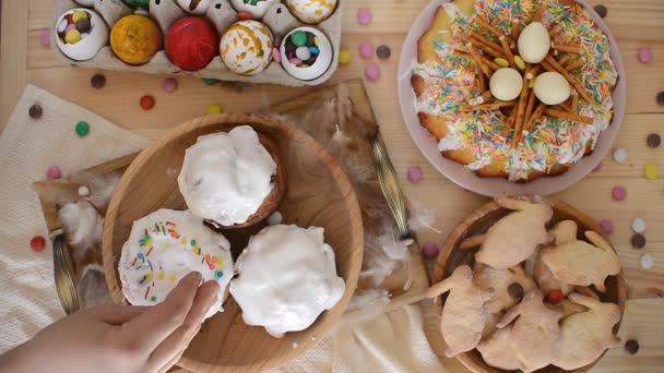 Easter. Decorating Easter cakes with colored sugar canfetti — Stock Video