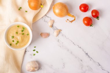 French onion soup on a white table