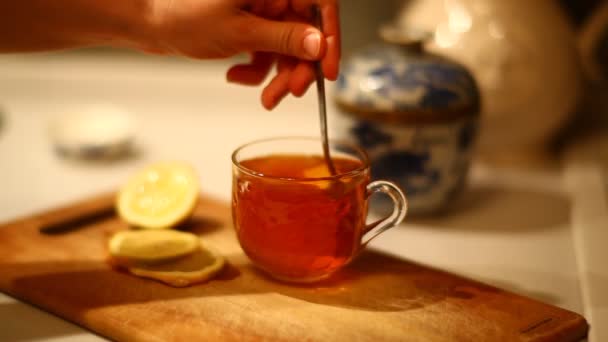 Mixing lemon and sugar in glass — Stock Video