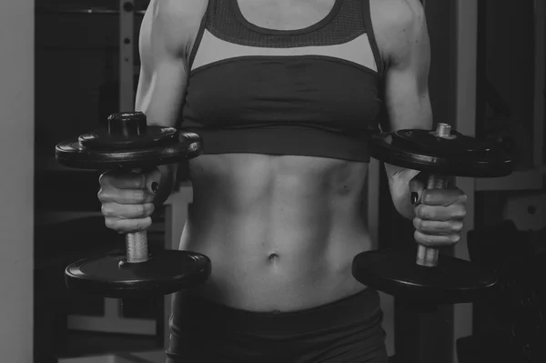 Sport blonde. Beautiful strong girl. Bodyfitness, women's fitness. Woman doing exercises at the gym. Beauty, health, and sports.Bodybuilder young adult sexy girl — Stock Photo, Image