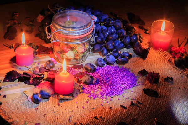 Beautiful composition with grapes and candles. Beautiful play of light. — Stock Photo, Image
